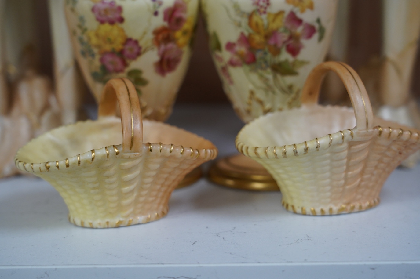 A pair of Worcester vases, shape number 1730, a pair of similar baskets and a pair of Locke & Co. Worcester vases, tallest 16cm. Condition - fair to good, one Locke & Co. vase has a small hairline crack, wear to gilding